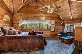 Interior of Allenspark Lodges Great Room with rustic log furnishings in Allenspark, Colorado.