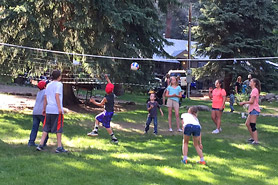 Kids playing volleyball at Bear Paw Lodge, Cabins, and Vacation Homes in Durango, Colorado.