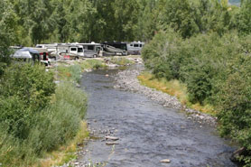 RV camping along the Rio Chama River at Rio Chama RV Park in Chama, New Mexico.