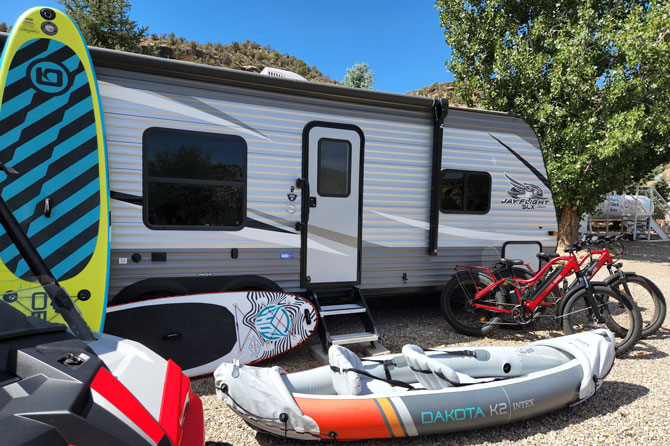 RV trailer with recreational equipment at Naturita RV Park in Naturita, Colorado.